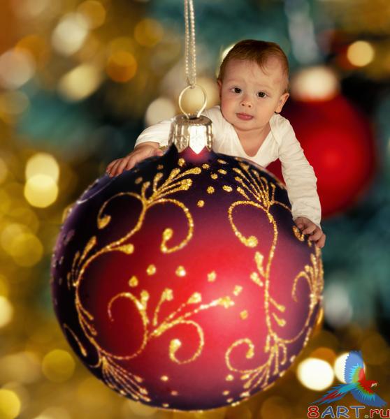      / One year old kid on a Christmas tree ball